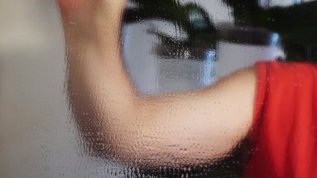 With love and expertise, a pleasant man washes windows, glass, and sometimes even suffering souls.
