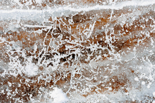 Frost crystals on brown ground winter texture background