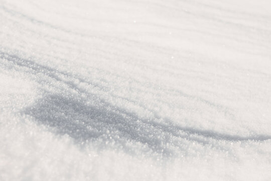 Soft snow texture with shimmering winter light background