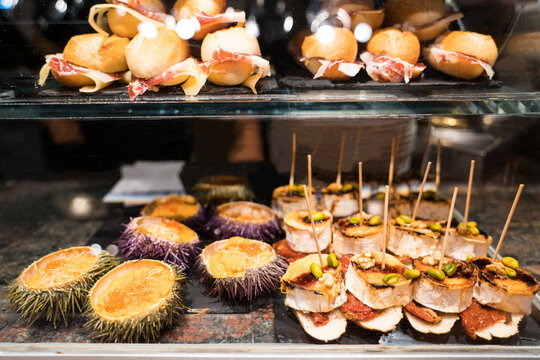 Basque pintxos selection with seafood and cured ham tapas