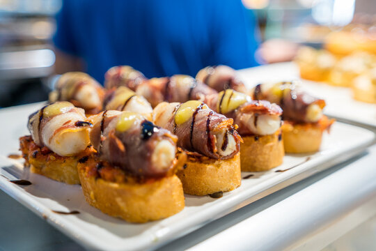 Basque pintxos with meat on toasted bread