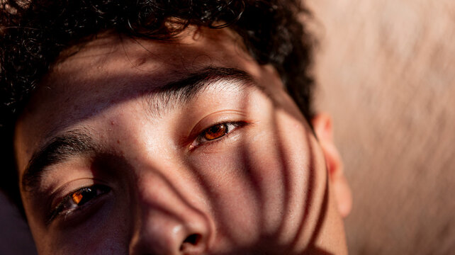 Mexican teenager portrait with dramatic shadow pattern