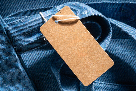 Blank kraft label on blue denim cotton textile