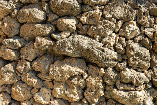 Rough volcanic tuff stone background surface for graphic design templates