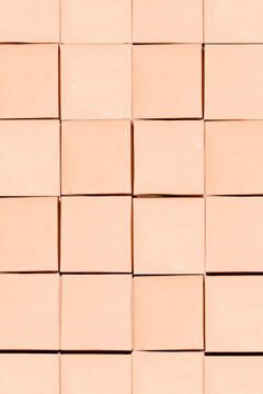 Beige square tile surface with geometric grid texture