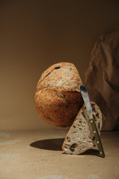 Artisan bread still life with knife and sliced loaf