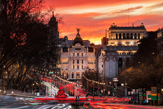 Fiery sunset over Calle de Alcala and Metropolis building
