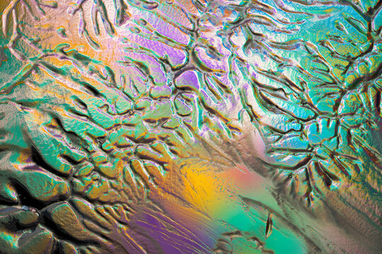 Colorful abstract textured surface with iridescent relief pattern