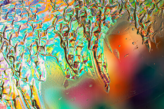 Iridescent abstract glass texture with prismatic color pattern