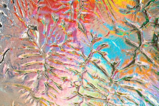 Colorful abstract cracked texture with iridescent pop art effect