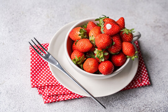 Fresh organic strawberry in bowl for healthy summer snack