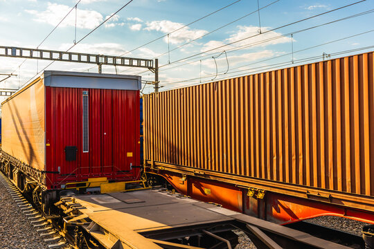 Freight train wagon at railway station under overhead wire