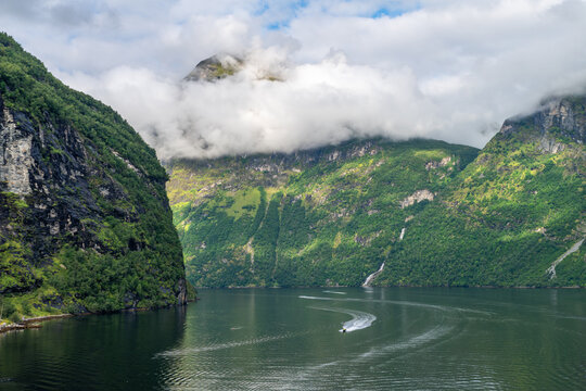 Misty mountain fjord landscape in Geiranger, Norway