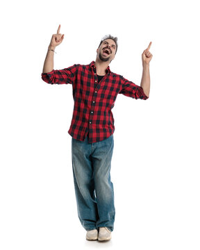 Enthusiastic man screaming and pointing up