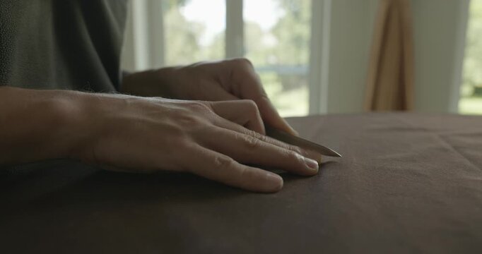 Close-up male hands do filing nails manicure. 4K 10-bit