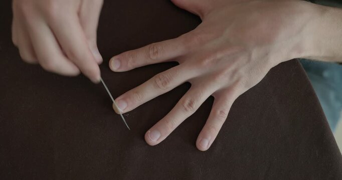 Close-up male hands do filing nails manicure. 4K 10-bit