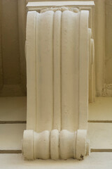 Close up view of a decorative plaster corbel bracket support on a classical building exterior wall. © nahhan