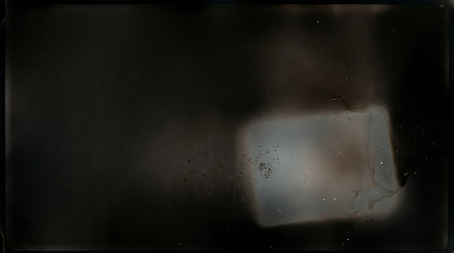 Abstract dark film grain texture with light leak and chemical emulsion drift effect