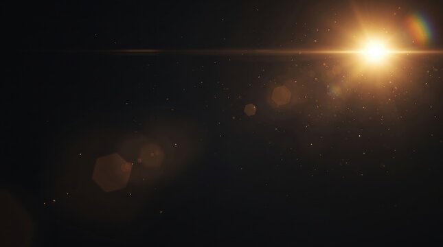 Bright sun flare with golden lens glint and floating dust particles glowing on dark dramatic black background.