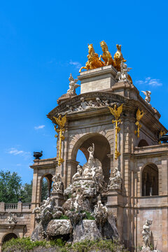 Close up view of Cascada Monumental fountain and golden Chariot of the Aurora sculpture in Parc de la Ciutadella Barcelona. Spain