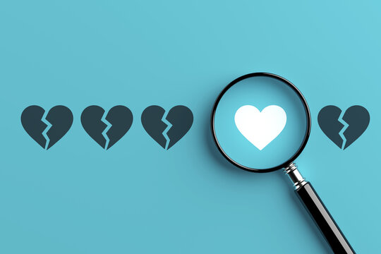 Finding True Love Concept. Magnifying Glass Highlights A Whole White Heart Among Broken Hearts On Cyan Background. 3d Rendering