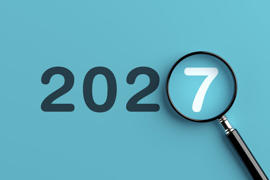 New Year 2027 Focus Concept. Magnifying Glass Highlights Number Seven In 2027 On Cyan Background. 3d Rendering