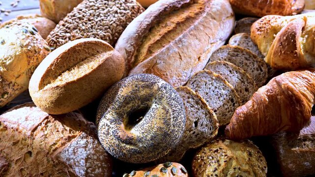 Assorted bakery products including loaves of bread and rolls