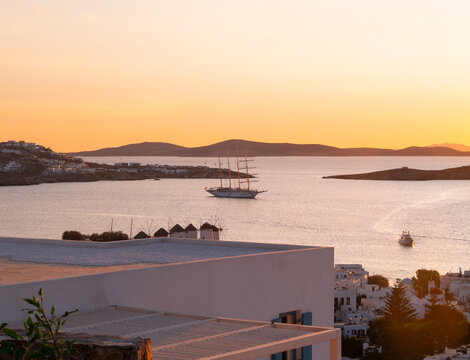 A cruise ship tour on the island of Mykonos in Greece at sunset