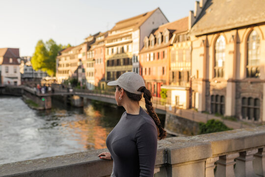 Woman admiring canal in La Petite France, Strasbourg