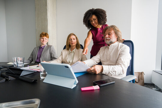 Team Members Discussing Plans in an Office Meeting