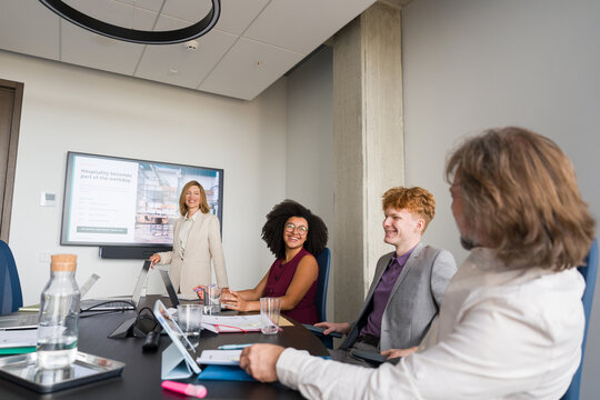 Meeting Takes Place in Office With Team Discussing Ideas