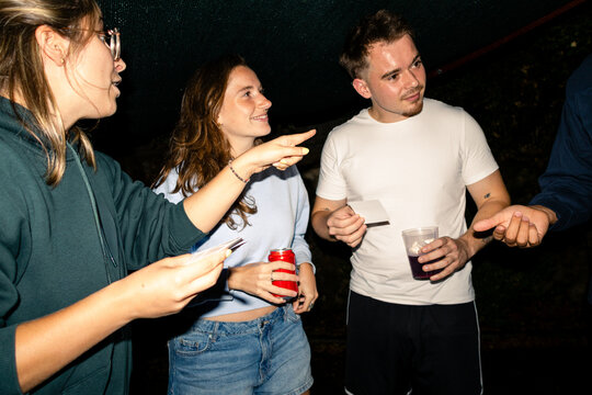 Conversation among friends at an evening party