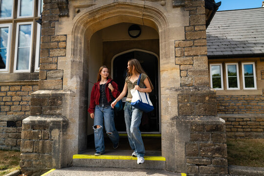 Duo exits the school building after final classes