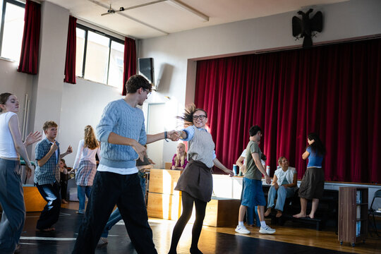 Cheerful duo dancing together
