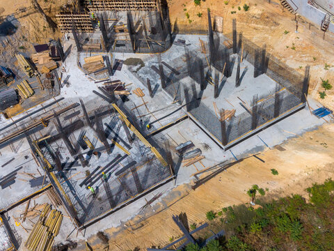 Aerial View Of Construction With Tower Crane And Concrete Foundation