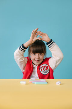 Happy Young Girl with down syndrome Looking at Camera