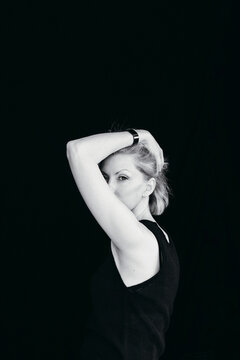 Expressive Portrait of a Woman With Striking Posture and Gaze