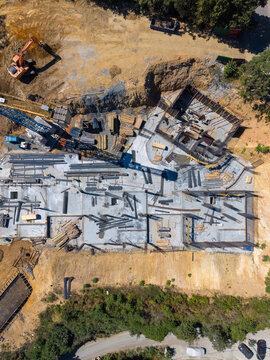Aerial View Of Construction With Tower Crane And Concrete Foundation