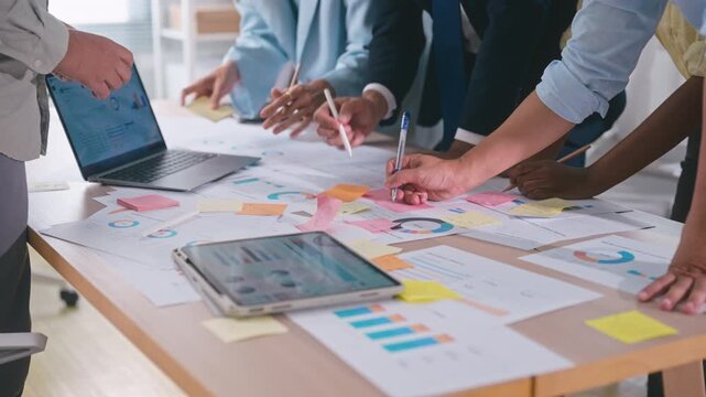 Business hands creating project financial charts and data mind map with colorful sticky notes