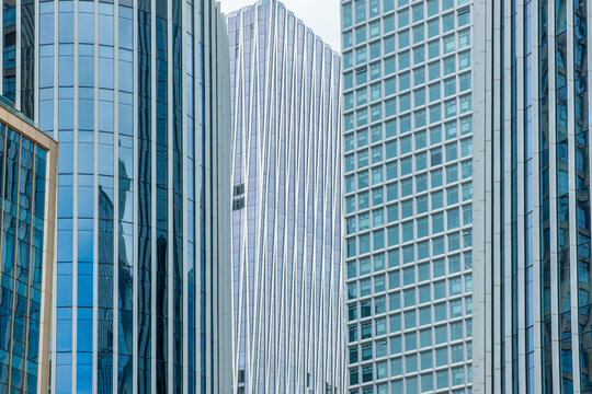 Glass skyscraper facades with grids, vertical lines and window patterns in Shenzhen, China. Geometric architecture background, abstract urban texture, facade design, structural rhythm