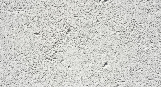 Gray textured surface with yellow stain.