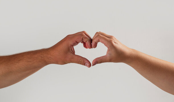 Heart hands show love symbol. Heart gesture creates romantic concept. Human fingers form heart shape. Two hands express heart affection.