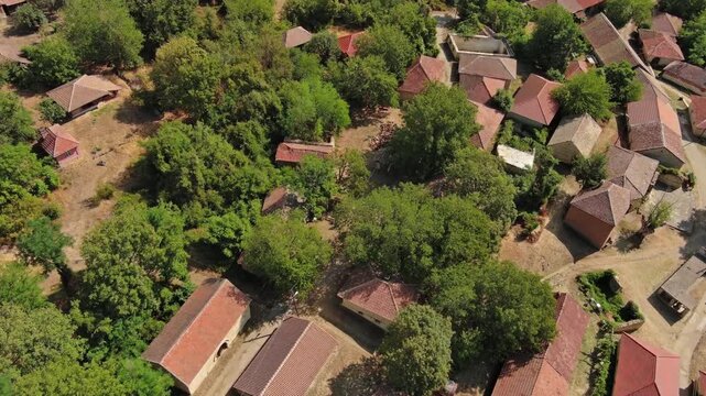 Aerial view of old rustic vintage houses with wine cellars in Rogljevacke pivnice in Negotin region of Serbia, 4k