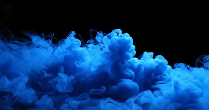 Blue ink pigment cloud swirling and diffusing in clear liquid