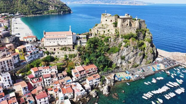 Scilla, Calabria, Italy. Scenic view of Marina Grande pebble beach, turquoise waters of the Tyrrhenian Sea