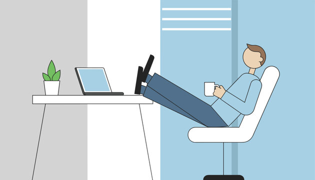 Relaxed office employee sitting at computer desk with feet up while drinking hot coffee during break.