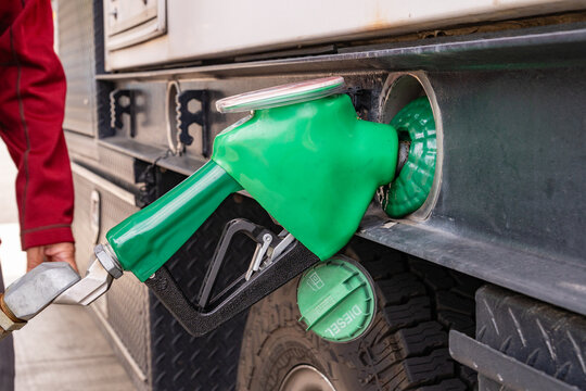 Green diesel gas pump at gas station.