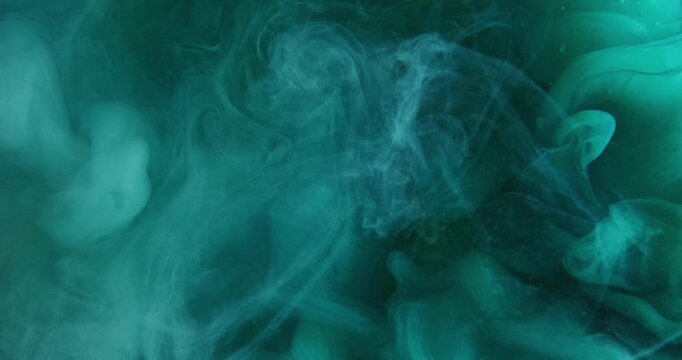 Blur smoke fluid. Ink wave. Blue green color puff stream in curl cloud. Abstract mist cyan pigment dissolving in water background.
