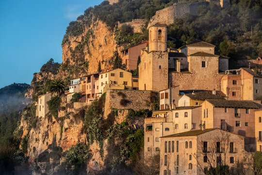 View at sunrise of the beautiful village of Miravet, Tarragona, Catalonia, Spain, with the Ebro River in the foreground