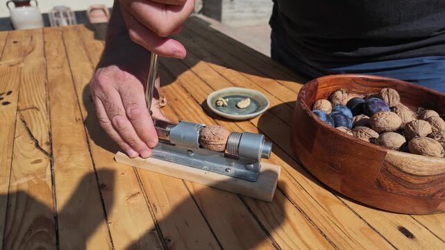 POV Slow Motion Shot of Walnut Shell Being Cracked Open Today